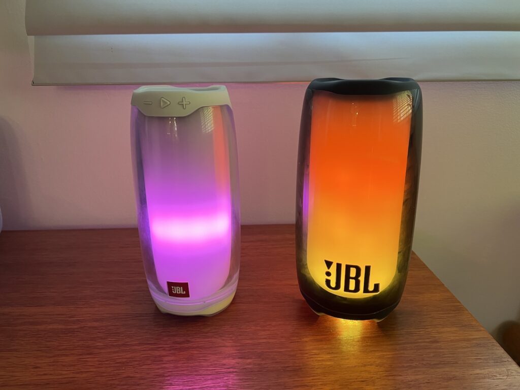 JBL Pulse 4 and 5 speakers on a table